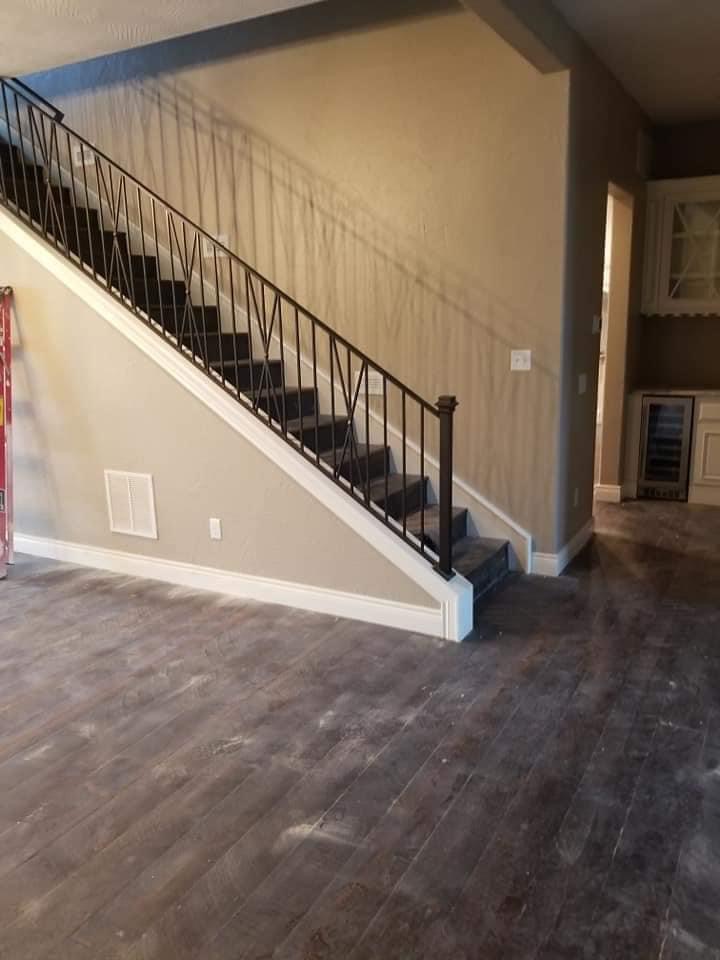 Two-story stairwell repaint with greige walls in Nixa, MO